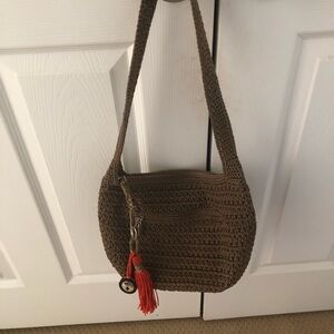 The Sak Brown Crochet Shoulder Bag with Red Tassel
